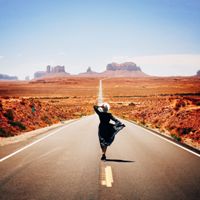 solo-female-traveler-in-a-bohemian-dress-walking