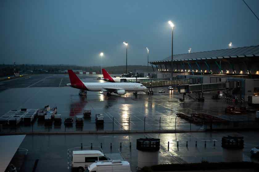 Airport-terminal-building-with-planes - travel and tour world