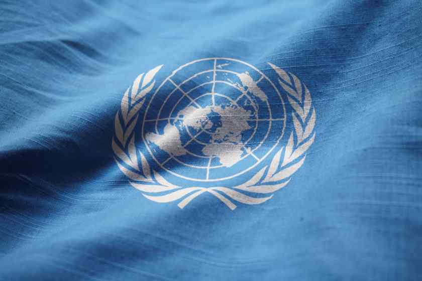 Closeup-ruffled-united-nations-flag-united-nations-flag-blowing-wind - travel and tour world