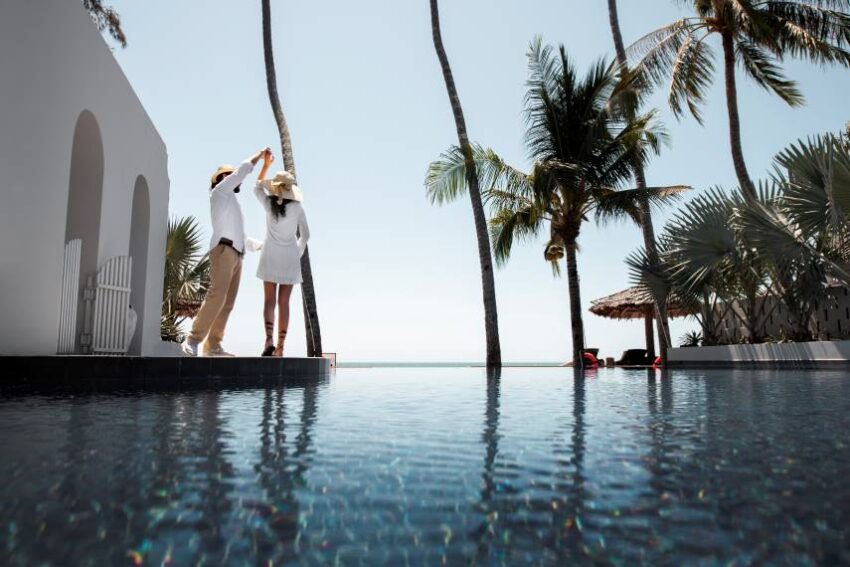 Couple-dancing-by-pool-vacation - travel and tour world