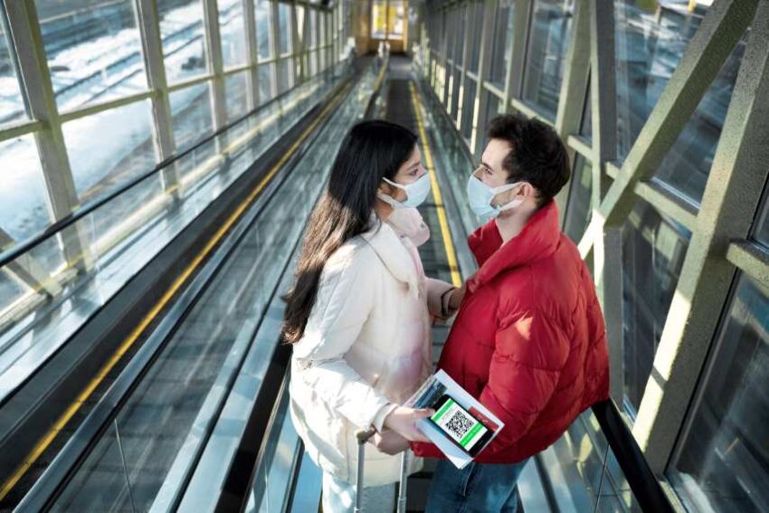 Couple-traveling-with-vaccination-passports - travel and tour world