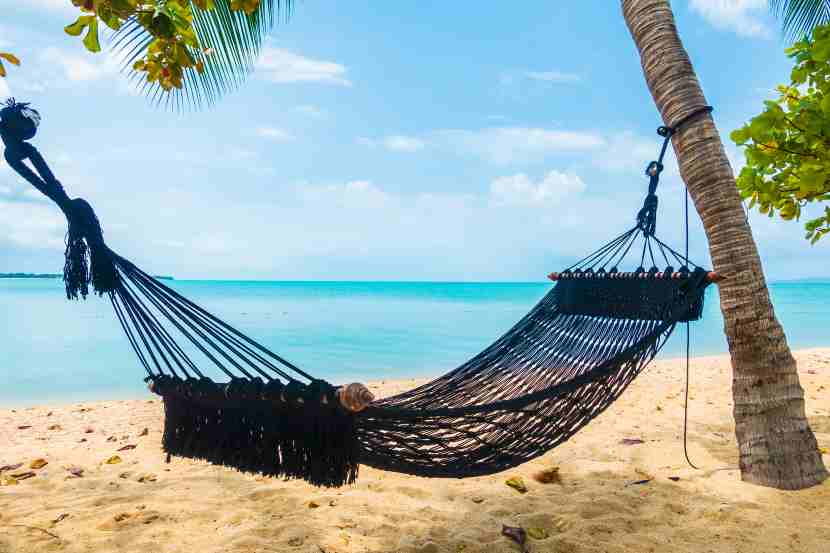 Empty-hammock-swing-around-beach-sea-ocean-with-white-cloud-blue-sky-travel-vacation - travel and tour world