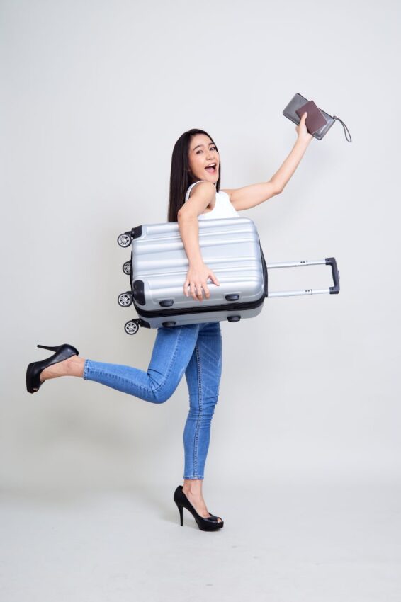 Happy-young-asian-woman-travel - travel and tour world