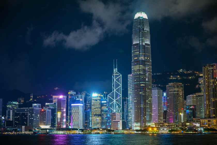 Illuminated-modern-buildings-city-against-sky-night - travel and tour world