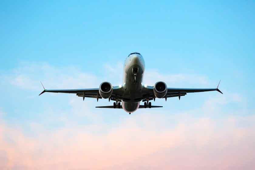 Passenger-jet-plane-flies-sky-air-transport-industry - travel and tour world