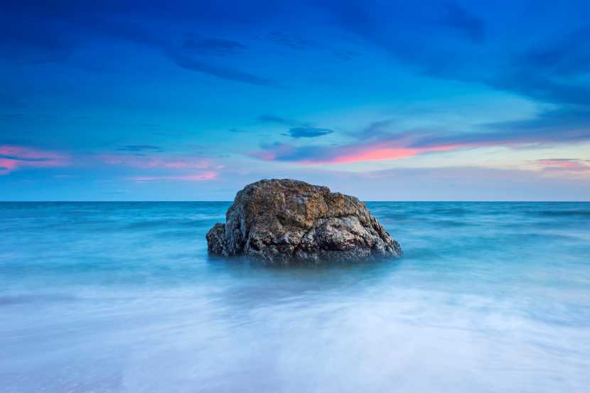Rocks-sea-against-sky-sunset - travel and tour world