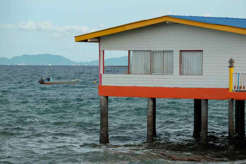 Stilt-house-sea-against-sky - travel and tour world