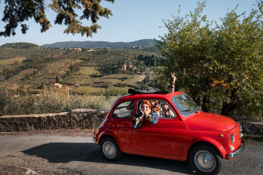 Medium-shot-people-traveling-by-car - travel and tour world