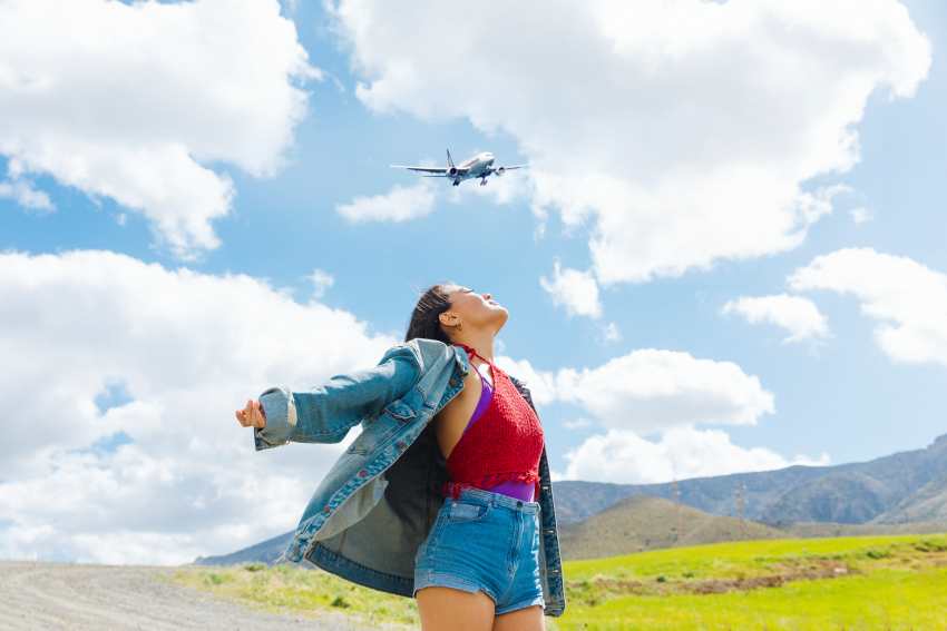 People-portrait-with-plane-flying-sky - travel and tour world