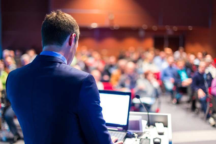 Speaker-business-conference-presentation-audience-conference-hall - travel and tour world