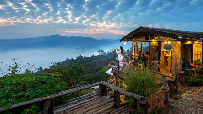 Woman-taking-photo-morning-mist-phu-lang-ka-phayao-thailand - travel and tour world
