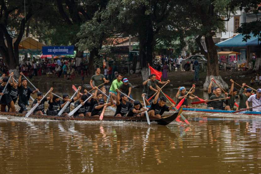 Boat race - travel and tour world Bon om touk water festival in phnom penh with vibrant boat races, illuminated river, and fireworks under the full moon.