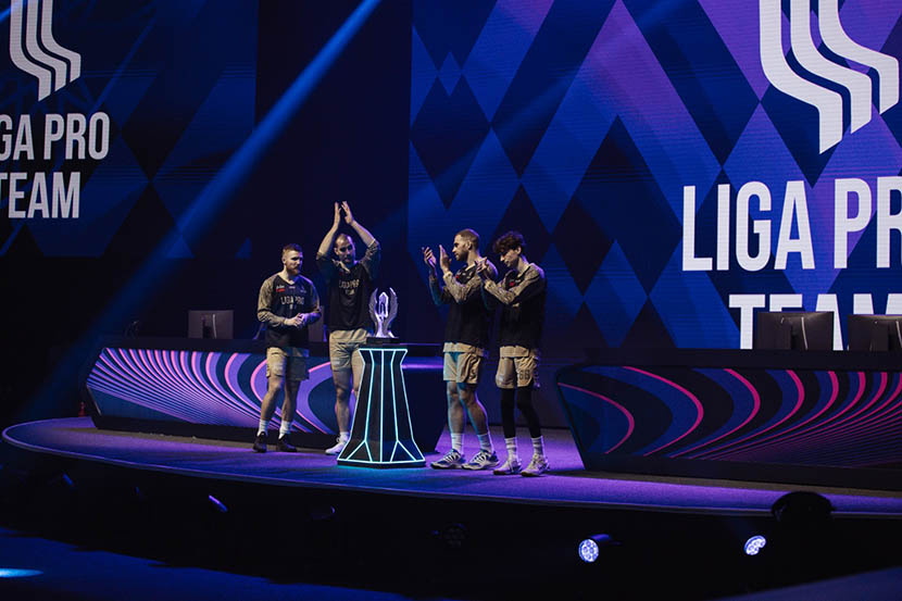 Create a composite overlay collage showcasing intense moments from the phygital football, esports, and phygital drone racing events. Include the official logo of the games of the future abu dhabi 2025 in bold, vibrant colors, with overlay text saying “the future of sports is phygital! ”