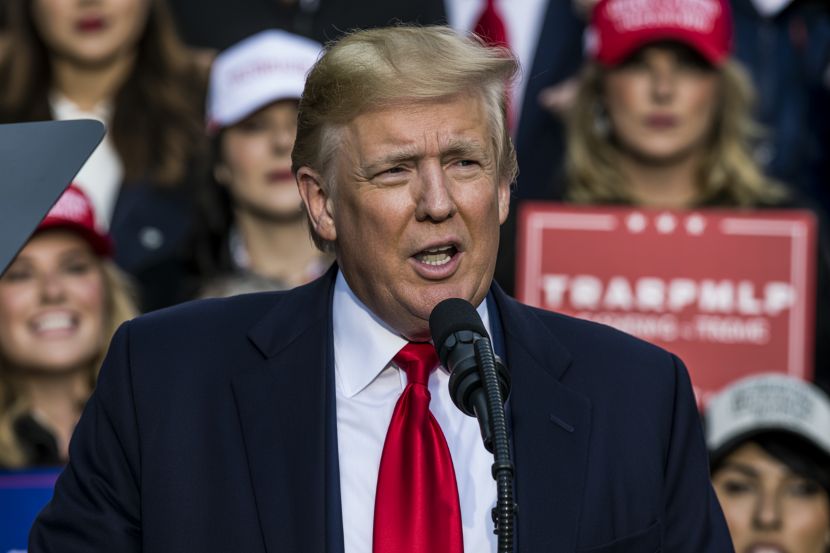 President donald trump speaks at a rally, discussing various policies, including the expanded u. S. Travel restrictions.