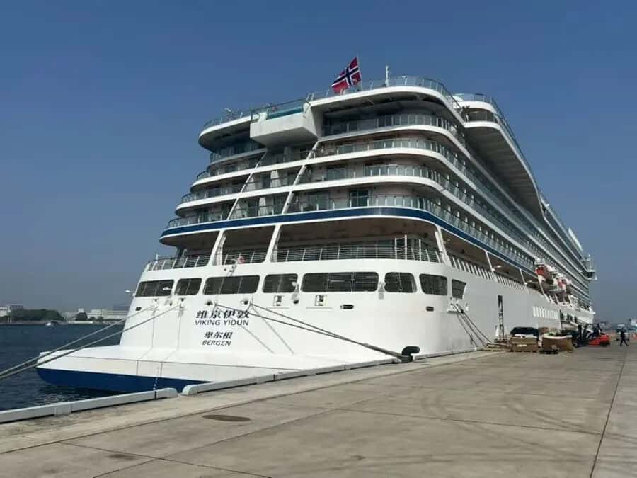 Luxury cruise ship viking yi dun docked at port.