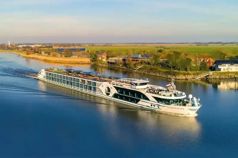 Luxury river cruise ship sailing on european waterways for solo travelers. - travel and tour world Luxury river cruise ship on europe's rivers with solo travel options.