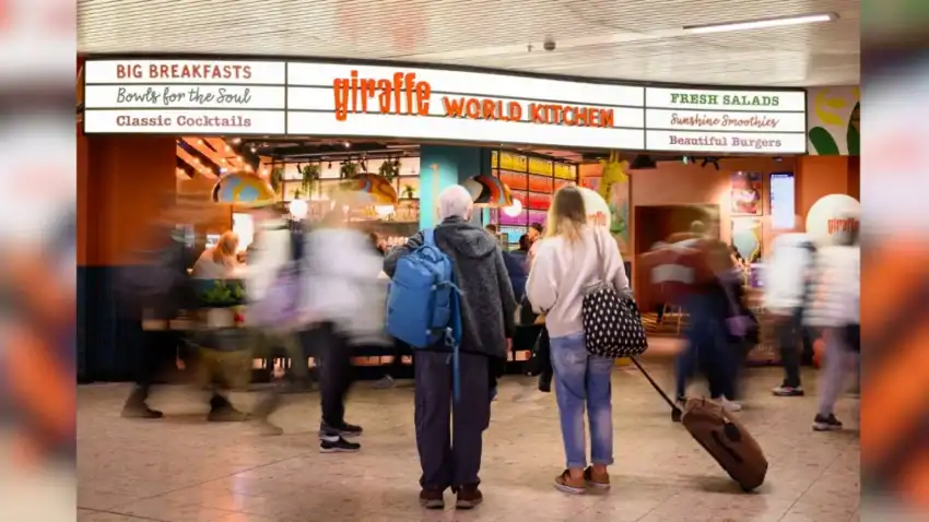 A bustling travel and tourism hub with travelers waiting at a food court.