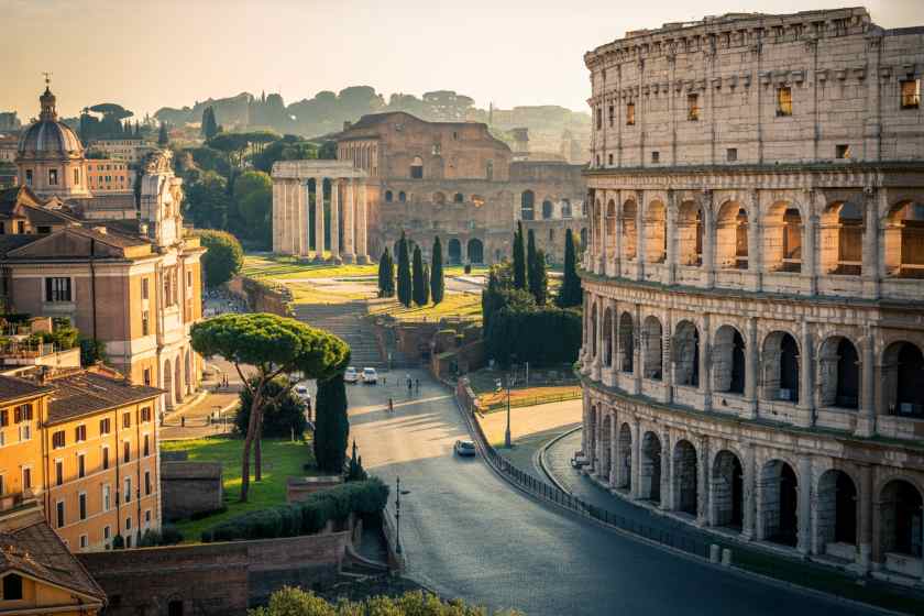 Ancient roman architecture in rome, italy, with the colosseum and historic ruins.