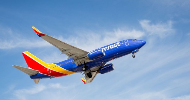 Travel and tour world - travel and tour world Southwest airlines jet in flight against blue sky.