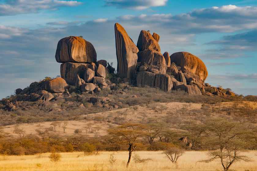 Ancient rock formation in the african savannah, showcasing unique geological fea.