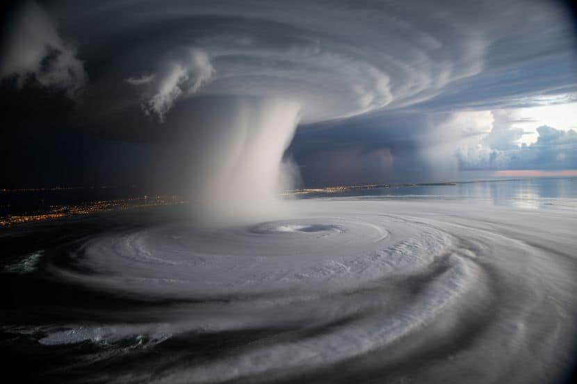 Tornado over the ocean - travel and tour world United states travel alert