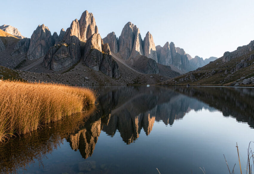 Scenic mountain landscape with a tranquil lake reflecting jagged peaks in new ze.