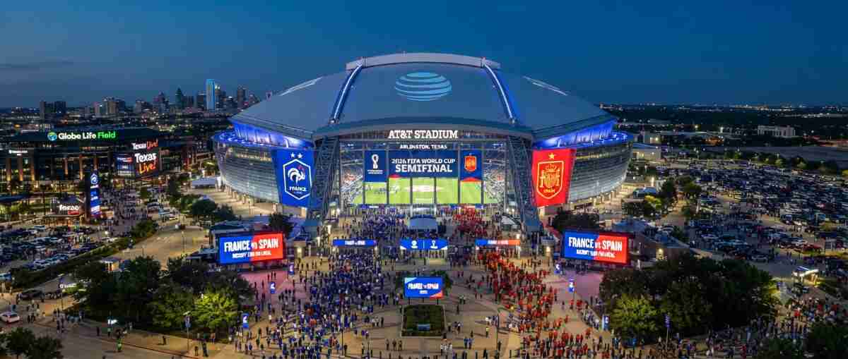 A panoramic view of the at&t stadium in arlington, texas, illuminated during the preparations for the 2026 fifa world cup semifinal between france and spain.