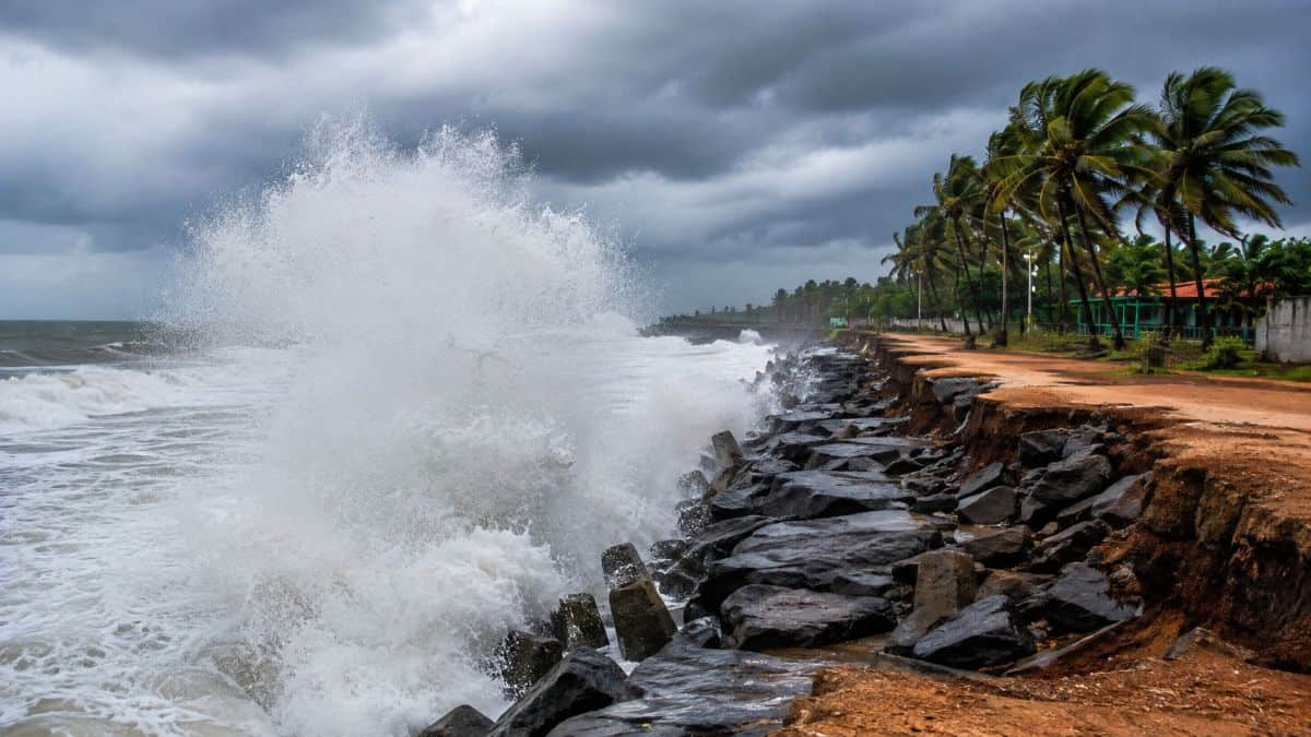 Rough ocean waves approaching kerala coastline during a swell surge warning with a deserted beach - travel and tour world Rough ocean waves approaching kerala coastline during a swell surge warning with a deserted beach