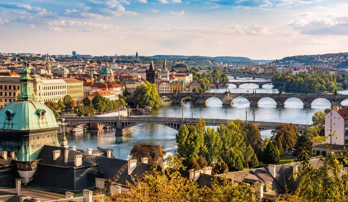 Prague skyline featuring historic rooftops charles bridge vltava river and stunning european architecture under a beautiful blue sky - travel and tour world Prague skyline featuring historic rooftops charles bridge vltava river and stunning european architecture under a beautiful blue sky