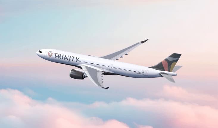 Trinity airways aircraft featuring the new airline branding at a south korean airport terminal with passengers preparing for international travel.