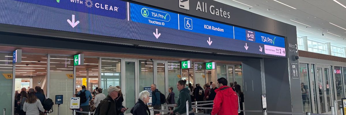 Family members greeting a traveller at an airport gate under the new tsa gateside access programme in the united states