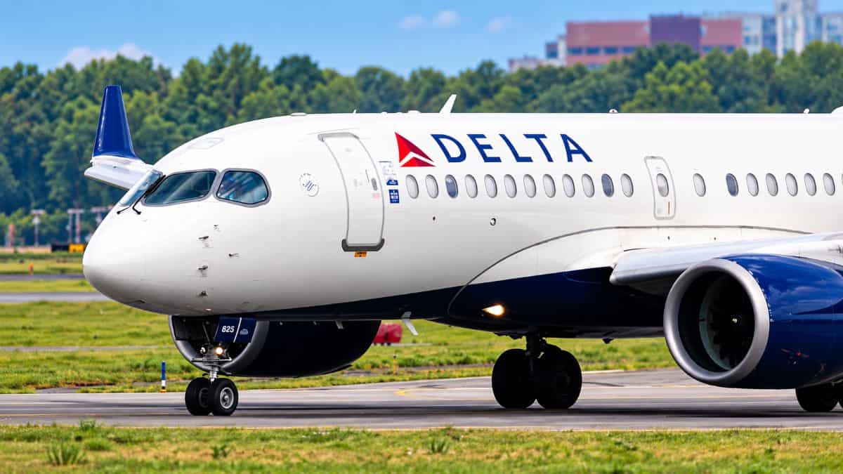 A delta air lines widebody aircraft parked on the airport tarmac preparing for a transatlantic departure.