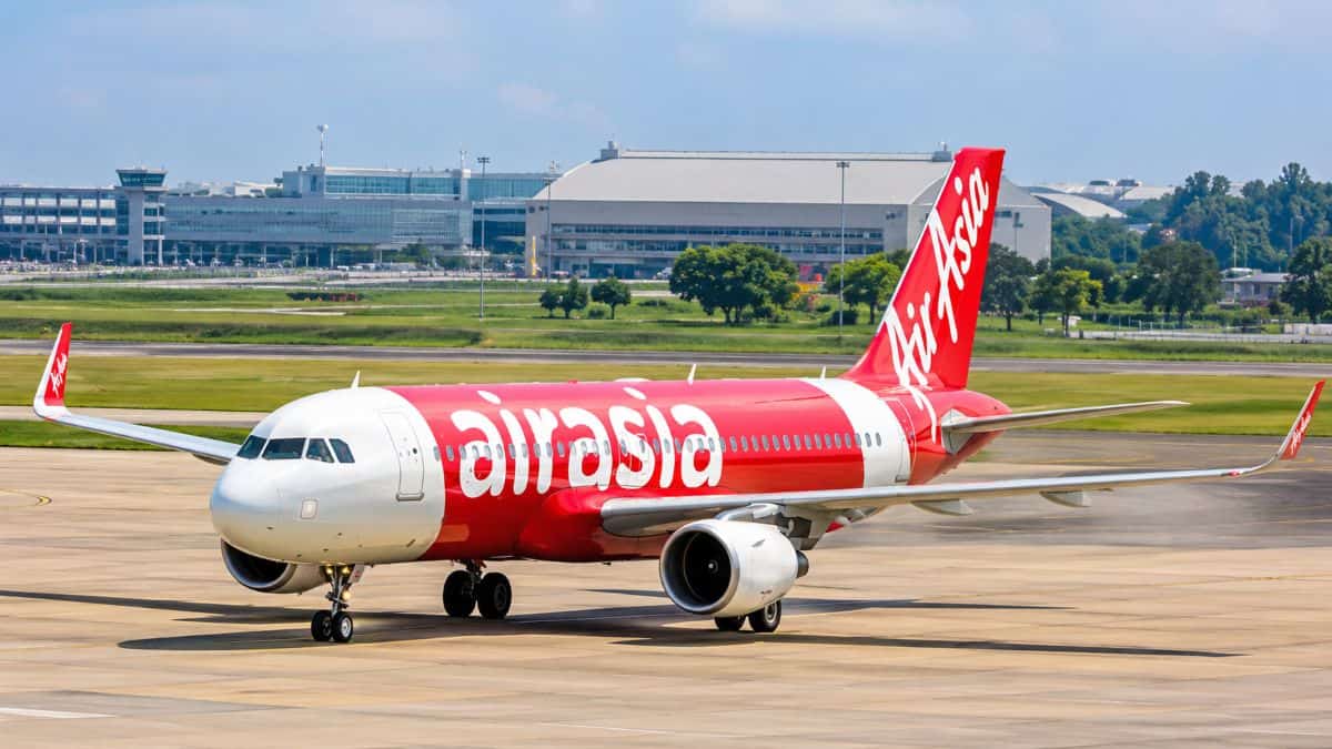 Airasia aircraft at an airport representing regional travel demand, airline liquidity and financial scrutiny