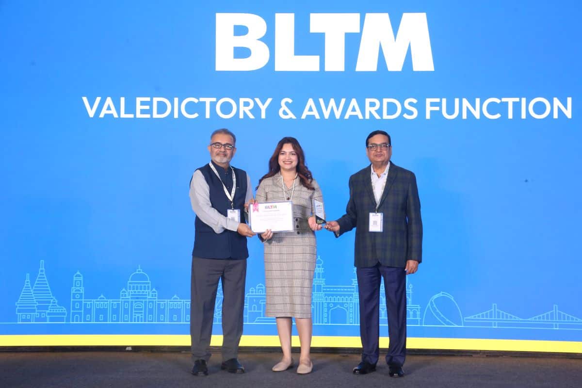 Bltm 2026 award ceremony with three officials presenting the excellence in international destination promotion award