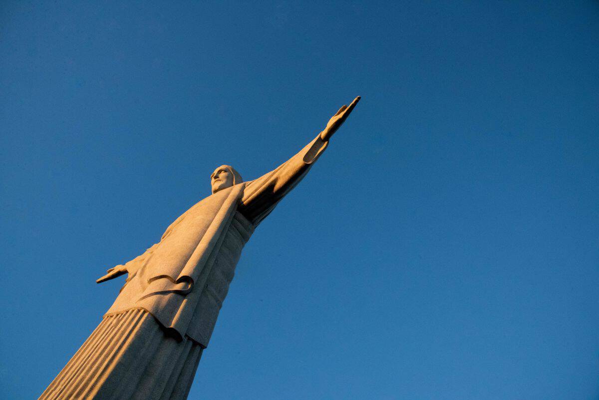 Christ the redeemer statue against a clear blue sky in rio de janeiro, brazil