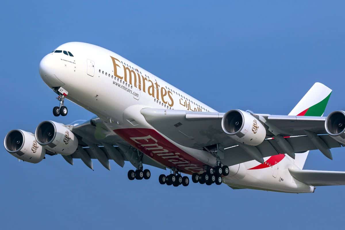Emirates airbus a380 taking off against a clear blue sky