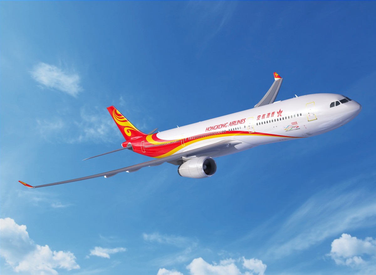 Hong kong airlines aircraft at hong kong international airport supporting aviation growth, tourism connectivity and ai travel innovation