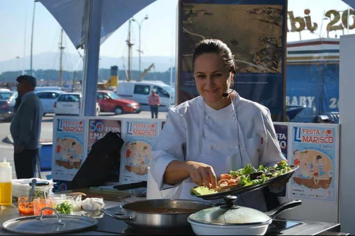 Spain - travel and tour world A bustling galician harbor filled with visitors enjoying traditional seafood tastings during the o grove seafood festival in pontevedra,spain.