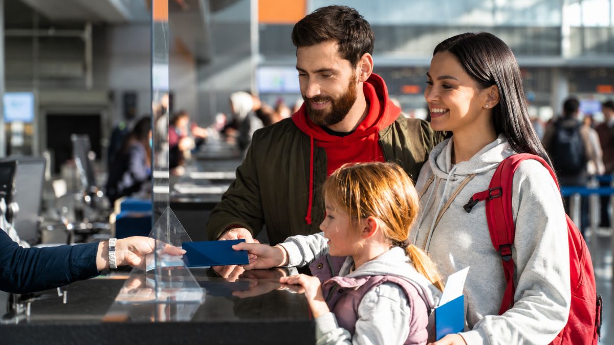 Travellers queue at a european airport as the eu entry exit system introduces new biometric border checks