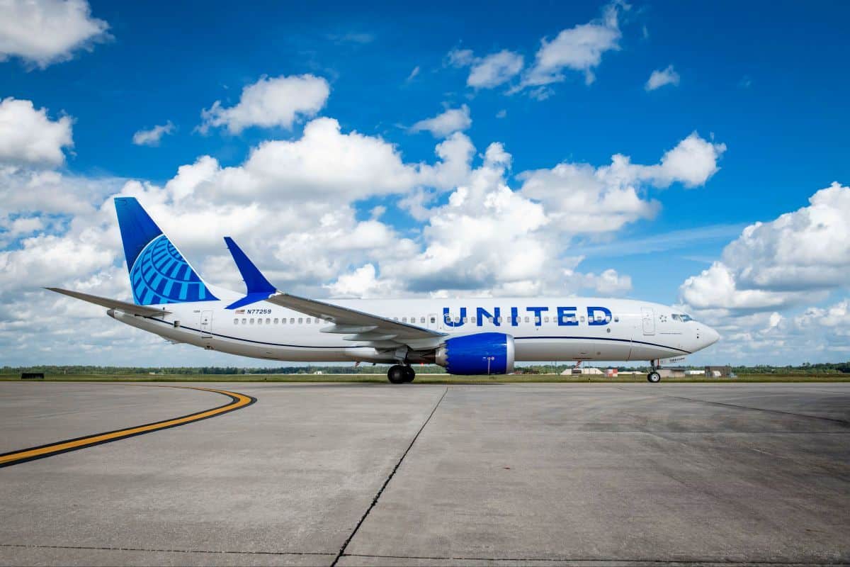 United airlines aircraft at newark with dubai skyline representing delayed dubai flights until 2027