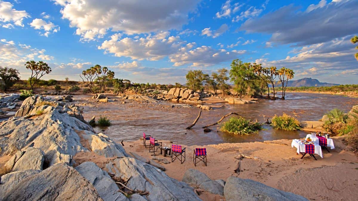 Wildlife safari landscape in kenya&rsquo;s samburu national reserve featuring rugged hills and golden evening light.
