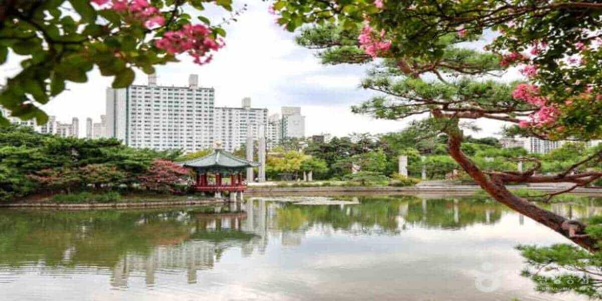 Seoul urban park lake with traditional korean pavilion