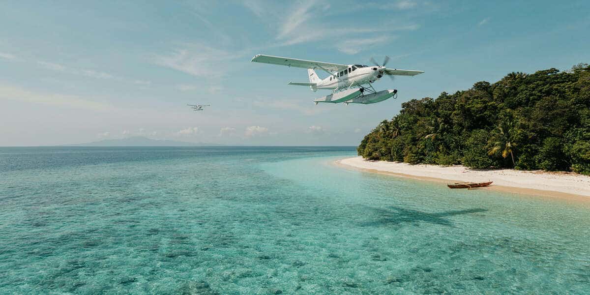 Santai seaplane flying over indonesia islands
