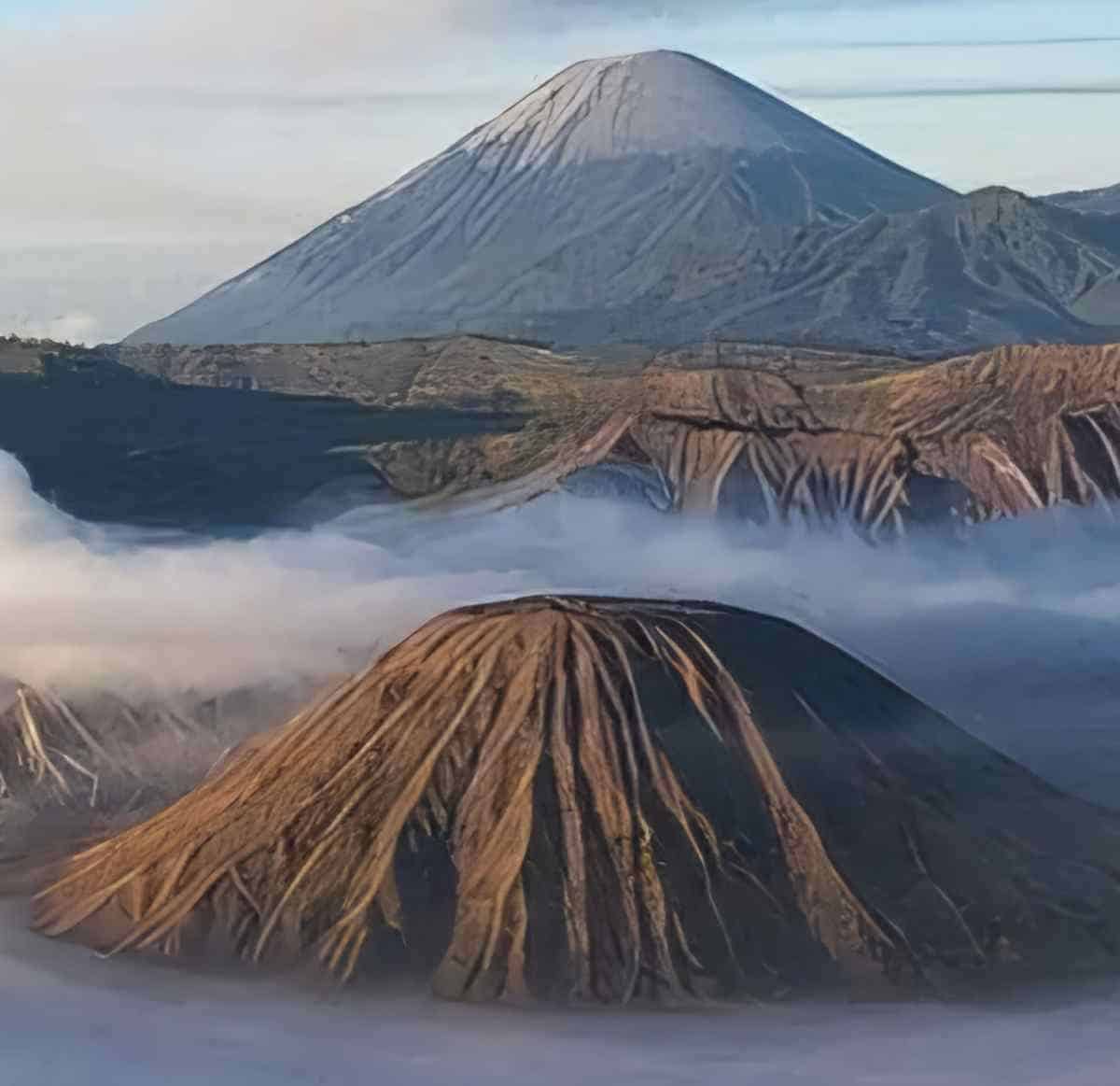 Ijen&rsquo;s volcanic highlands combine crater trekking, coffee plantations and geothermal experiences across east java.