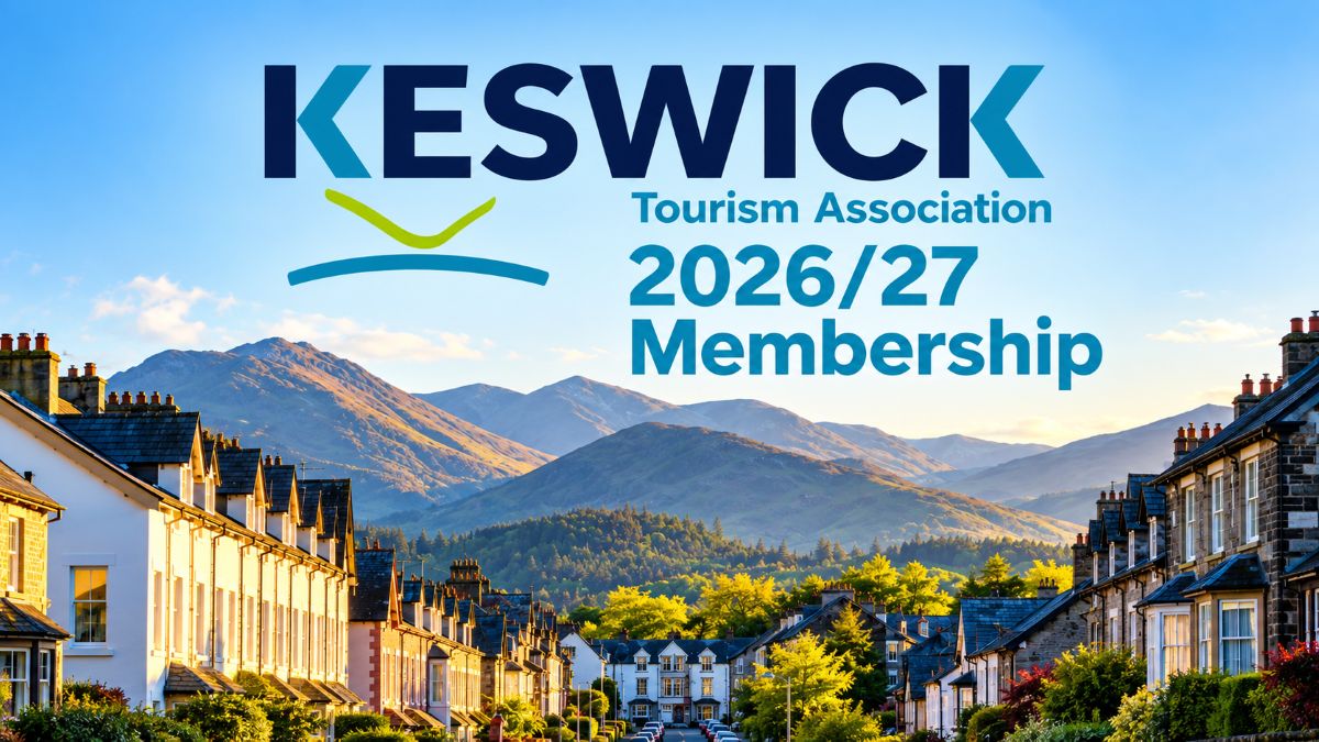 Keswick tourism association 2026/27 membership banner featuring a scenic lake district town, traditional buildings, and sunlit mountains beneath a clear blue sky.