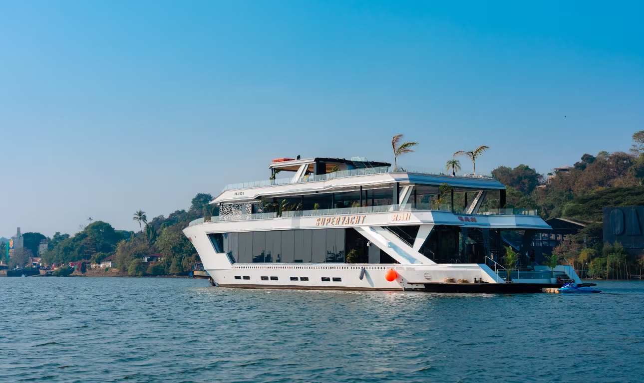 Goa - travel and tour world Ra11 superyacht featuring spacious luxury decks and modern white architecture, cruising along goa’s scenic waterways in india.