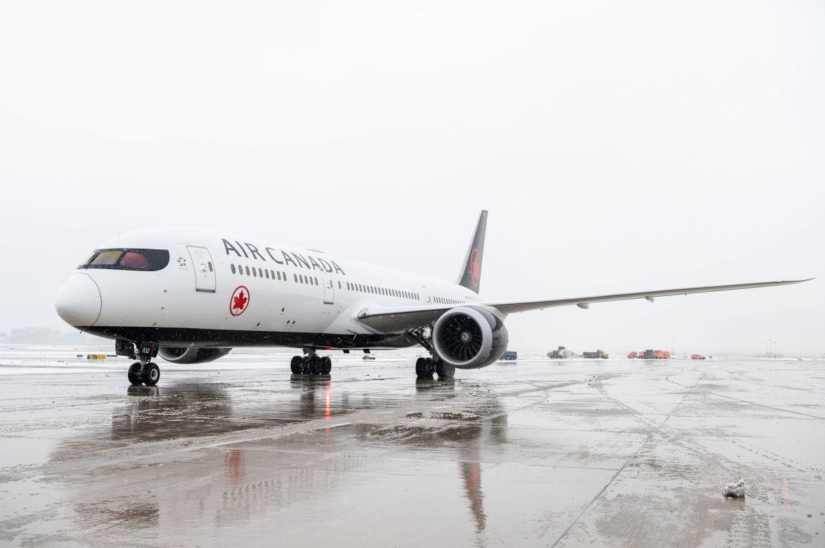 Air canada - travel and tour world Air canada aircraft on a snow-covered airport runway