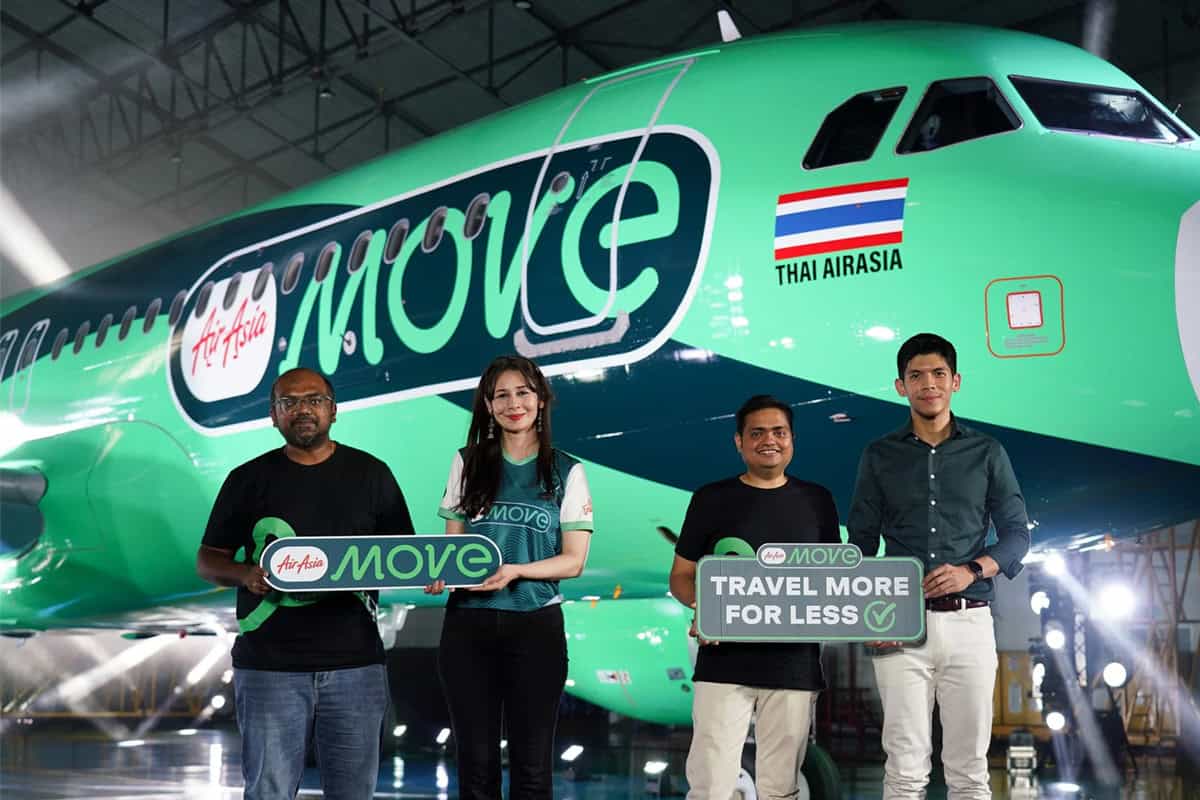 Airasia - travel and tour world People smiling infront of airasia flight