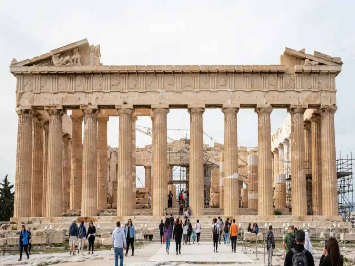 Athens - travel and tour world Panoramic view of athens, greece, highlighting its historic landmarks and dense urban landscape.