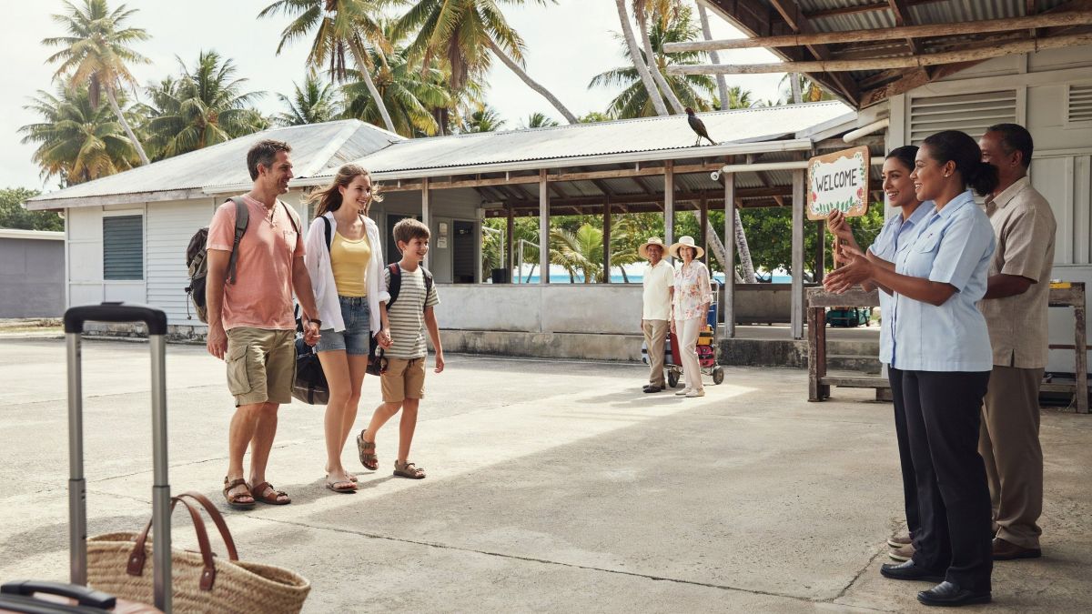 Australian travellers arrive at a pacific island airport for a holiday.